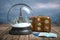 Eiffel tower in the snow globe, vintage suitcase and passports with visa stamp. Travel or trip to Paris and France in winter for