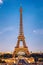 Eiffel tower in summer, Paris, France. Scenic panorama of the Eiffel tower under the blue sky. View of the Eiffel Tower in Paris,