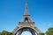 Eiffel tower, sunny summer day with blue sky in Paris