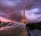 Eiffel tower on a sunset half-lit with last rays of the setting