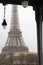 The Eiffel Tower under the Bir Hakeim bridge in the rain in Paris