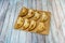 Eight Argentine empanadas of different flavors ready for snack on bamboo