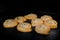 Eight baked buns with poppy seeds in electric oven at home