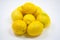 Eight fresh lemons in a bag