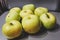 Eight green apples