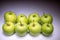 Eight green apples