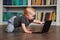 Eight months old todler baby playing with tablet pc on the floor