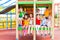 Eight preschoolers sitting together on climbing frame