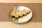 Eight servings of sushi maki roll stuffed with Japanese rice with vinegar and Norwegian orange salmon rolled