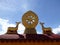 Eight-spoked Dharma wheel on lotus flower, flanked by a pair of deer on the roof of Jokhang Monastery, Lhasa, Tibet