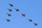 Eight Swiss Air Force Northrop F-5 jets flying in a special formation making a â€˜1â€™