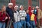 Eight Teens Leaning against Brick Building