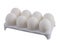 Eight white eggs with one cracked in white carton