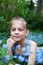 Eight-year-old  girl with forget-me-nots flowers