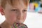 Eight Years Child Licking Colorful Round Lollipop