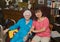 Eighty-seven year-old mother smiling and gazing affectionately at her beloved Korean daughter-in-law.