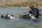 Eilat, Israel - May 2018: Scuba diving course. Men with breathing apparatus are diving into sea. Sport activity vacation