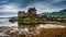 Eilean Donan Castle with tide on lake in Scotland