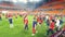 Ekaterinburg, Russia - June, 2018: View of Russian football volunteers in the same red and blue uniform walking on the