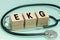 EKG Echocardiogram, Heart rate test, Medical concept, Inscription on wooden blocks and a stethoscope