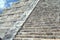 El Castillo details. closeup to a Mexican Pyramid. Temple of Kukulcan in Chichen Itza, Mexico