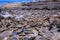 El Cotillo - Faro del Toston: View over black volcanic sharp volcanic rocks on ocean horizon north Fuerteventura