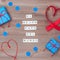 El mejor papa del mundo words that mean best dad in the world made of wooden blocks with blue gift boxes and red hearts on wooden