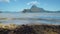 El Nido bay. Palawan, Philippines. Banca boat in lagoon. Calm waves rolling on sandy beach coastline. Cadlao island in