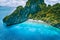 El Nido, Palawan. Aerial drone view of tropical Entalula Island. Huge steep rocks cliffs mountains with blue bay and