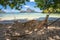 El Nido, Palawan, Philippines. A bamboo hammock in the shade with beautiful tropical cadlao island in morning light the