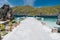 El Nido, Palawan, Philippines. Dock pier on Matinloc island with tropical island in background