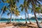 El Nido, Palawan, Philippines. Palm trees on sandy beach. tourist filippino banca boat in turquoise ocean lagoon. Island hopping