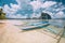 El Nido, Palawan, Philippines. White banca boat on sandy beach with crystal clear water ready for island hopping trip