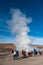 El Tatio, Atacama, Chile - January 13, 2019: Tourists watching geyser in the Los GÃ©iseres del Tatio area in the Atacama Desert