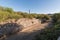 El Triunfo brick Smelter smoke stack with pathway lined with stone walls, Baja Mexico