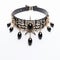 Elaborate Black And Gold Star Choker With High-key Lighting
