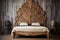 elaborate carved wooden headboard on a vintage bed