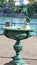 Elaborate green drinking fountain with dragon spout
