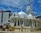 The elaborate white Jain Temple, Mombasa Kenya on a sunny day with blue sky and high cloud