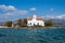 Elafonisos Peloponnese. Greece. Agios Spyridon church at island port, sunny day, blue sky