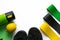 Elastic fitness gum expanders of yellow, green and black colors on white background with copyspace. Thermos bottle, lemon,