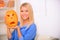 Elated girl holding pumpkin