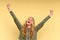 Elated joyful young woman cheering