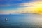 Elba island sunset view from Piombino an sail boat. Mediterranean sea. Italy