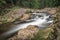 The Elbe river and waterfall in the mountains of Czech Republic