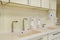 Elbow soap and antiseptic dispenser or sanitizer wall mounted for hand disinfection and water tap sink with faucet bathroom or