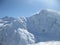 Elbrus mountains view in winter. Snow, wind and cl