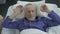 Elder basking in his bed rejoicing at new orthopedic mattress, comfortable sleep