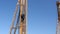 Elder is climbing on drilling machines tower