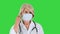 Elder doctor or nurse taking off medical mask smiling on a Green Screen, Chroma Key.